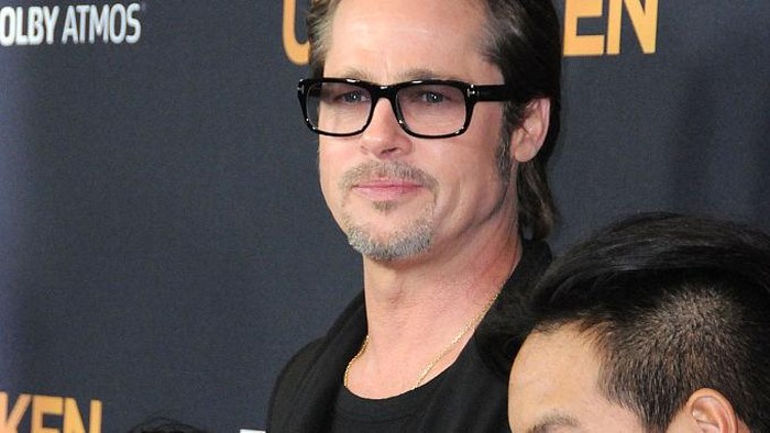 HOLLYWOOD, CA - DECEMBER 15:  (L-R) Pax Thien Jolie-Pitt, Shiloh Nouve Jolie-Pitt, actor Brad Pitt and Maddox Jolie Pitt attend the premiere of 'Unbroken' at TCL Chinese Theatre IMAX on December 15, 2014 in Hollywood, California.  (Photo by Barry King/FilmMagic)