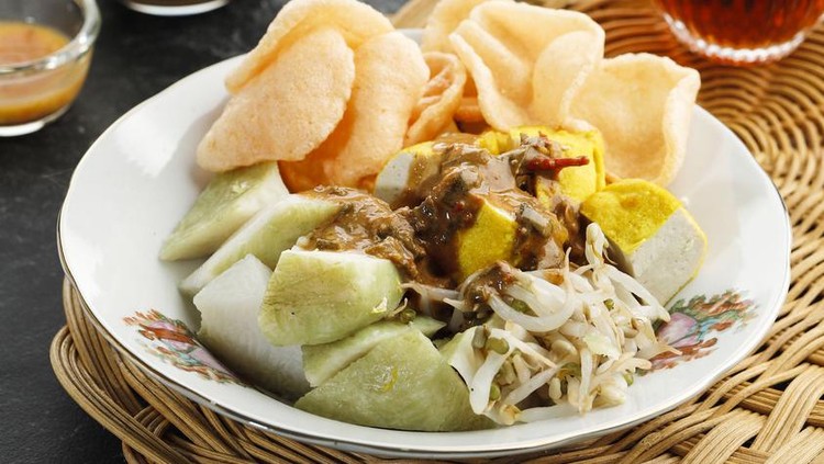 1451040074 Ketoprak or Kupat Tahu, Compressed Rice Cake or Lontong Served with Tofu, Boiled Bean Sprout, Karupuk, and Peanut Sauce. Indonesian Street Food for Breakfast
