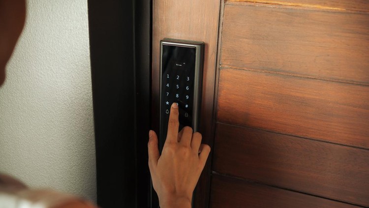 Close-up Asian Woman hand Pressing down on electronic access control at door house. Doors And Locks With Technology