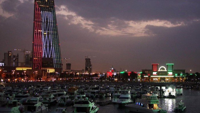TOPSHOT - Kuwaiti buildings are illuminated in the colours of the national flag on February 20, 2021, as the country prepares to celebrate their 60th Independence Day and the 30th anniversary of the end of the Gulf war with the liberation of Kuwait from Iraqi occupation. (Photo by YASSER AL-ZAYYAT / AFP) (Photo by YASSER AL-ZAYYAT/AFP via Getty Images)