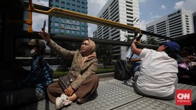 FOTO: Menikmati Libur Lebaran Naik Bus Wisata Jakarta Keliling Thamrin