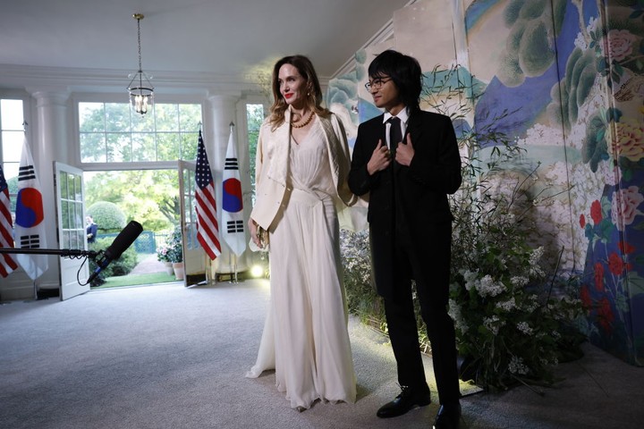 Actress Angelina Jolie, left, and Maddox Jolie-Pitt during a state dinner in honor of South Korean President Yoon Suk Yeol and South Korean First Lady Kim Keon Hee hosted by US President Joe Biden and First Lady Jill Biden at the White House in Washington, DC, US, on Wednesday, April 26, 2023. The US will strengthen the deterrence it provides South Korea against nuclear threats, securing a pledge from Seoul to honor commitments to not pursue its own atomic arsenal. Photographer: Oliver Contreras/Sipa/Bloomberg via Getty Images