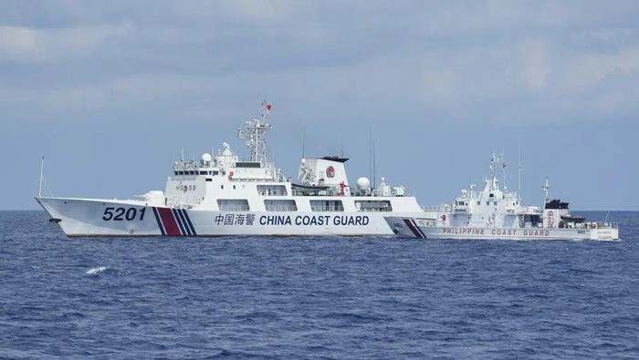A Chinese Coast Guard ship with bow number 5201 blocks Philippine Coast Guard ship BRP Malapascua as it maneuvers to enter the mouth of the Second Thomas Shoal locally known as Ayungin Shoal at the South China Sea on Sunday, April 23, 2023. The near-collision was among the tense confrontations encountered by two Philippine government vessels against China, which undertook a weeklong voyage in one of the world's most hotly contested sea passages to assert Philippine sovereignty. (AP Photo/Aaron Favila)