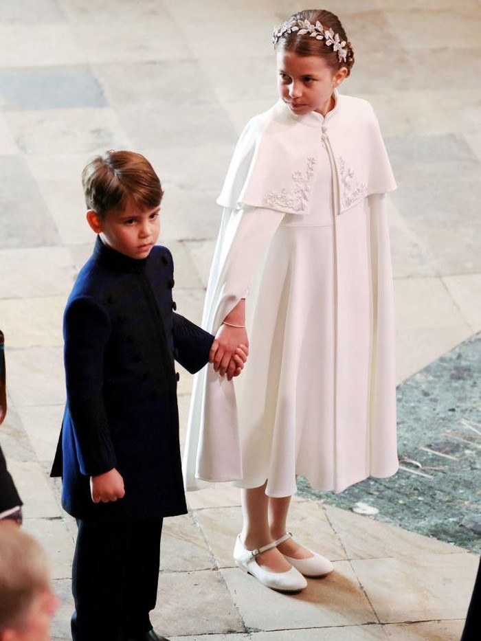 LONDON, ENGLAND - MAY 06: Princess Charlotte of Wales travelling in the state car during the Coronation of King Charles III and Queen Camilla on May 06, 2023 in London, England. The Coronation of Charles III and his wife, Camilla, as King and Queen of the United Kingdom of Great Britain and Northern Ireland, and the other Commonwealth realms takes place at Westminster Abbey today. Charles acceded to the throne on 8 September 2022, upon the death of his mother, Elizabeth II. (Photo by Stuart C. Wilson/Getty Images)
