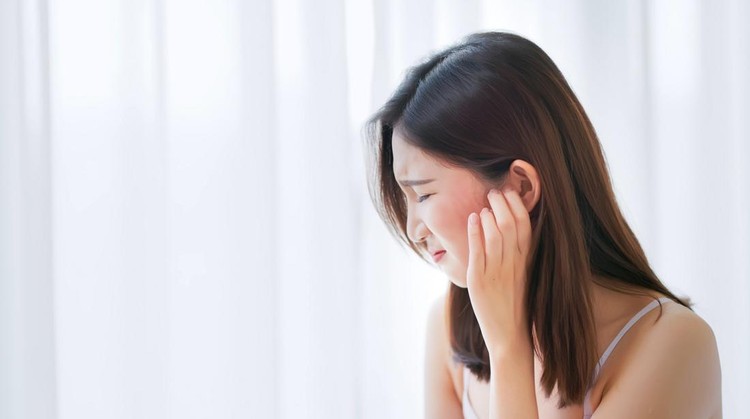 1342013241 asian beauty woman has dry skin and scratching her face