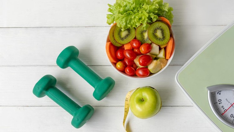 Diet Health food and lifestyle health concept. Sport exercise equipment workout with green apple and measuring tap, fresh salad for fitness style. Healthy Lifestyle Concept