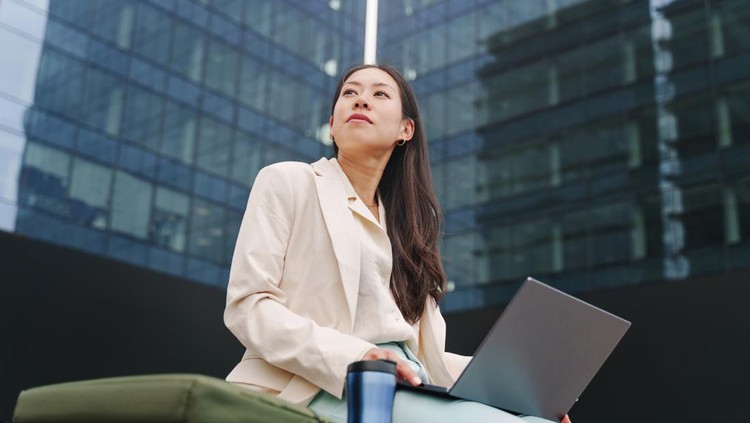 Young Asian Professional Business Woman working with laptop outside the office - Female inspiration and ambition