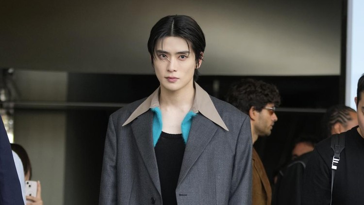 Korea's singer Jaehyun, member of K-Pop boy group NCT 127, stands at the end of the Prada men's Spring Summer 2024 fashion show, presented in Milan, Italy, Sunday, June 18, 2023. (AP Photo/Luca Bruno)