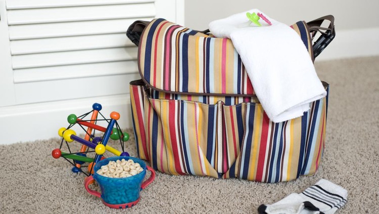 Essential items for baby and toddler, along with a diaper bag to pack them in.    NOTE TO INSPECTOR - The files in this series were requested by a potential buyer, hence the variety of similar images.  Thank you.