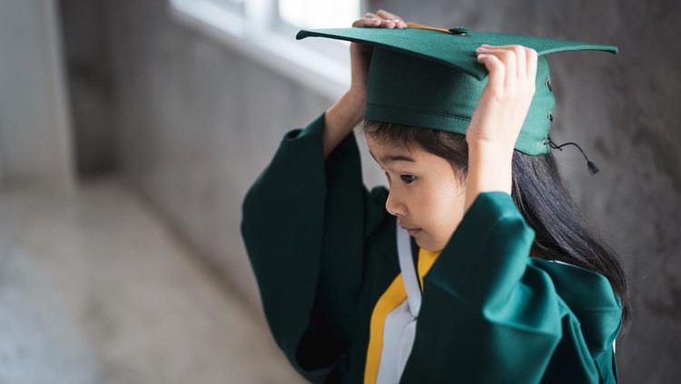 Childhood student with graduation gown, Thai People.