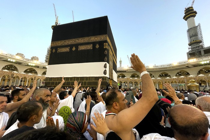 Thousands of Muslim pilgrims hold umbrellas as they circumambulate around the Kaaba, the cubic building at the Grand Mosque, during the annual hajj pilgrimage, in Mecca, Saudi Arabia, Sunday, June 25, 2023. Muslim pilgrims are converging on Saudi Arabia's holy city of Mecca for the largest Hajj since the coronavirus pandemic severely curtailed access to one of Islam's five pillars. (AP Photo/Amr Nabil) Thousands of Muslim pilgrims hold umbrellas as they circumambulate around the Kaaba, the cubic building at the Grand Mosque, during the annual hajj pilgrimage, in Mecca, Saudi Arabia, Sunday, June 25, 2023. Muslim pilgrims are converging on Saudi Arabia's holy city of Mecca for the largest Hajj since the coronavirus pandemic severely curtailed access to one of Islam's five pillars. (AP Photo/Amr Nabil)
