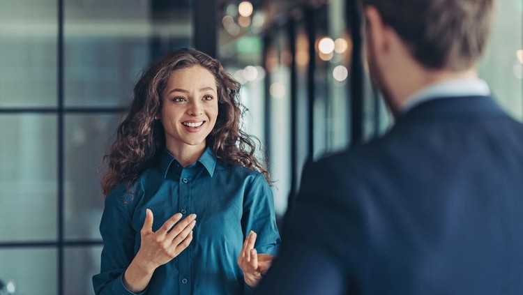 Businesswoman and businessman talking in the office