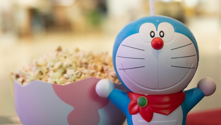 Bangkok, Thailand - January 3, 2020 : Cute toy of Doraemon set of bucket popcorn and soft drink to promote the movie : Nobita's New Dinosaur from Advertising Major Cineplex Group Plc.