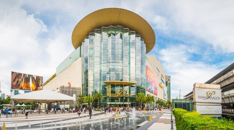 Shoppers walking through the plaza outside the Siam Paragon shopping mall in the Pathum Wan downtown district of Bangkok, Thailand’s vibrant capital city.