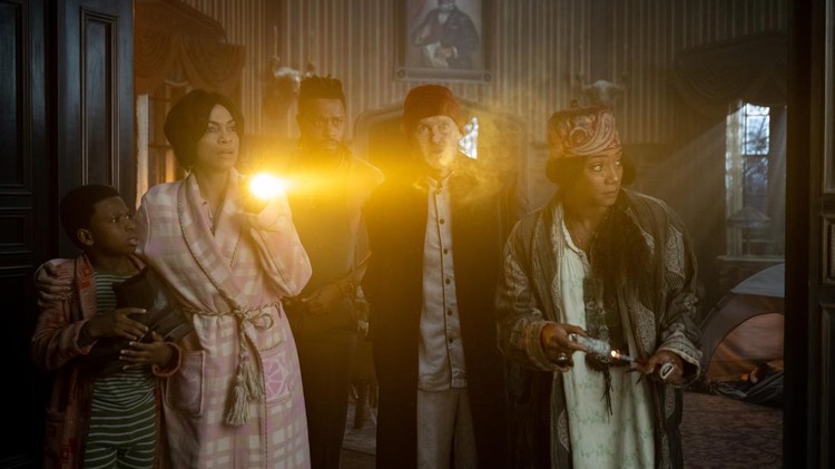 (L-R): Chase Dillon as Travis, Rosario Dawson as Gabbie, LaKeith Stanfield as Ben, Owen Wilson as Father Kent, and Tiffany Haddish as Harriet in Disney's HAUNTED MANSION. Photo by Jalen Marlowe. © 2023 Disney Enterprises, Inc.  All Rights Reserved.