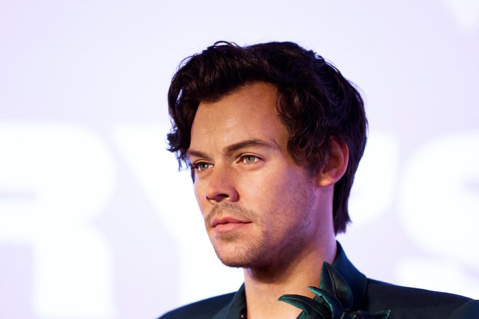 Fans pose with the new Harry Styles wax figure during its unveiling at the Madame Tussauds museum in London, Britain, July 26, 2023. REUTERS/Peter Cziborra      TPX IMAGES OF THE DAY