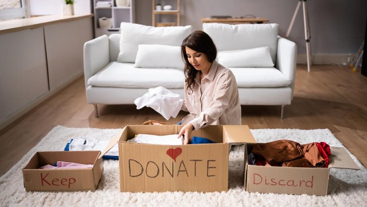 1393065538 Donating Decluttering And Cleaning Up Wardrobe Clothes