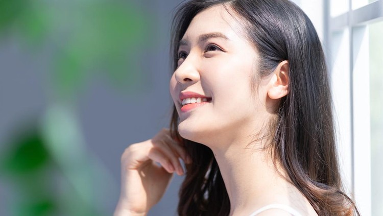 Beauty image of young Asian girl at home