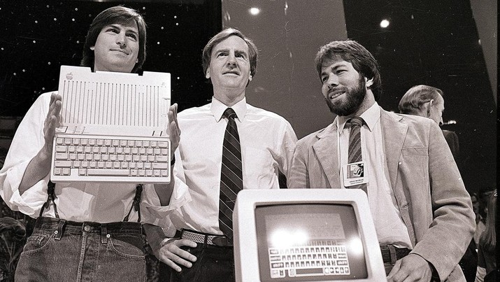 Steve Jobs-The Movie Star FILE - In this April 24, 1984 file photo, Steve Jobs, left, chairman of Apple Computers, John Sculley, center, president and CEO, and Steve Wozniak, co-founder of Apple, unveil the new Apple IIc computer in San Francisco. Steve Jobs, released Friday, Oct. 9, 2015, is the latest movie to examine a charismatic visionary who mesmerized the masses with his trendsetting gadgets while alienating his subordinates and friends with an almost-inhumane cruel streak. The story is told through Jobs interactions with six central figures in his life: his former marketing chief, Joanna Hoffman; his former girlfriend Chrisann Brennan; Apple co-founder and friend Wozniak; former Apple engineer Andy Hertzfeld; former Apple CEO Sculley; and Lisa, the daughter that Jobs refused to acknowledge for many years. (AP Photo/Sal Veder, File)