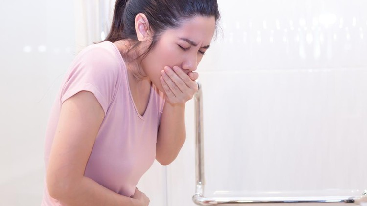 Asian Beautiful woman vomit caused by food poisoning or a stress or pregnant