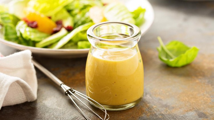 Homemade honey mustard salad dressing in a jar