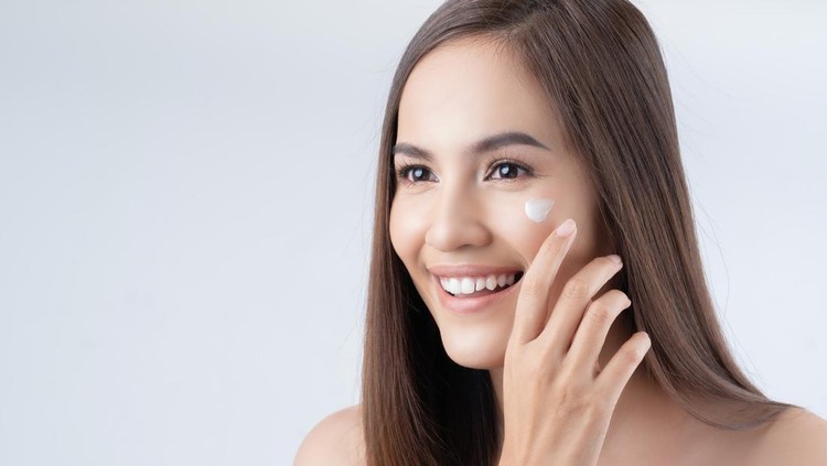 1459314468 Mirror reflection of woman with skincare cream, spa lotion or dermatology ointment for melasma or acne treatment. Bathroom facial routine, healthcare and face of girl apply cosmetics beauty product