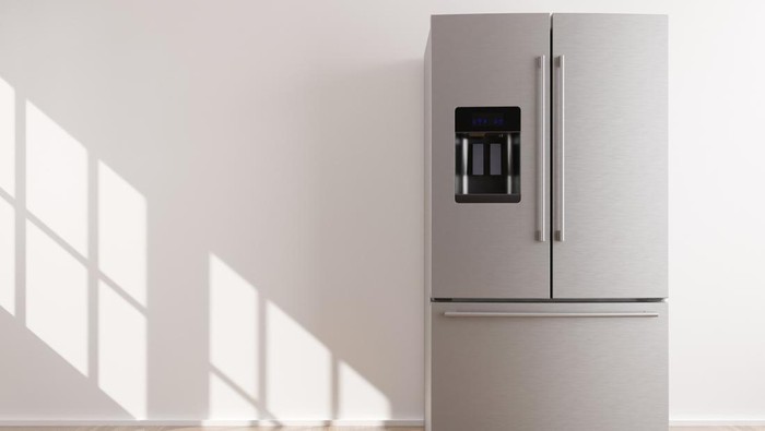 Refrigerator standing in empty room. Free, copy space for text or other objects. Household electrical equipment. Modern kitchen appliance. Stainless steel fridge with double doors, freezer. 3d render