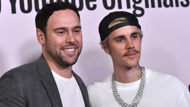 Justin Bieber dan manajernya 15 tahun, Scooter Braun, membantah mereka berpisah dan tak lagi bekerja sama seperti rumor yang beredar.