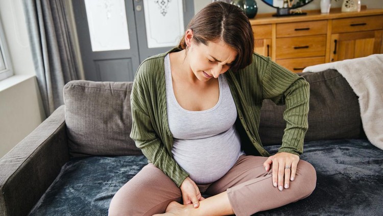 Woman suffering from wrist pain, numbness, or Carpal tunnel syndrome hand holding her ache joint