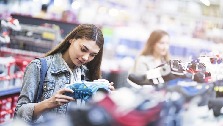 Woman looking shoes in store