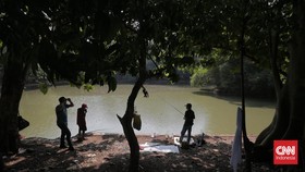 FOTO: Berlindung di Hutan Kota saat Polusi Udara Kepung Jakarta