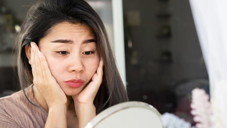 1292395413 Asian woman having problem with eyes bags , dark circles, wrinkle and crow's feet on her face skin