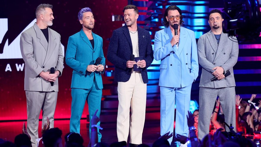 NEWARK, NEW JERSEY - SEPTEMBER 12: (L-R) Joey Fatone, Lance Bass, Justin Timberlake, JC Chasez, and Chris Kirkpatrick of  *NSYNC speak onstage the 2023 MTV Video Music Awards at Prudential Center on September 12, 2023 in Newark, New Jersey. (Photo by Theo Wargo/Getty Images for MTV)