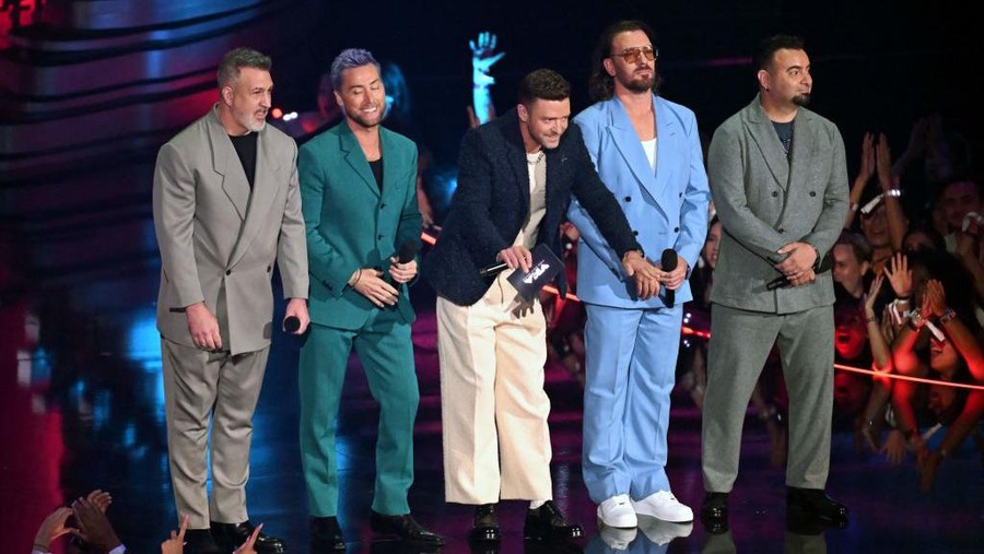 NSYNC (From L) Joey Fatone, Lance Bass, Justin Timberlake, JC Chasez and Chris Kirkpatrick of former boy band NSYNC speak onstage during the MTV Video Music Awards at the Prudential Center in Newark, New Jersey, on September 12, 2023. (Photo by Timothy A. CLARY / AFP) (Photo by TIMOTHY A. CLARY/AFP via Getty Images)
