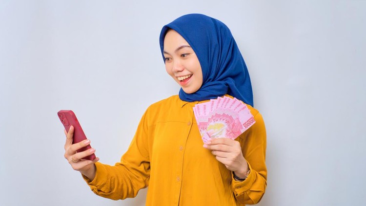 Ilustrasi wanita hijab pegang uang