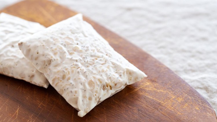 homemade Tempeh on wooden cutting board