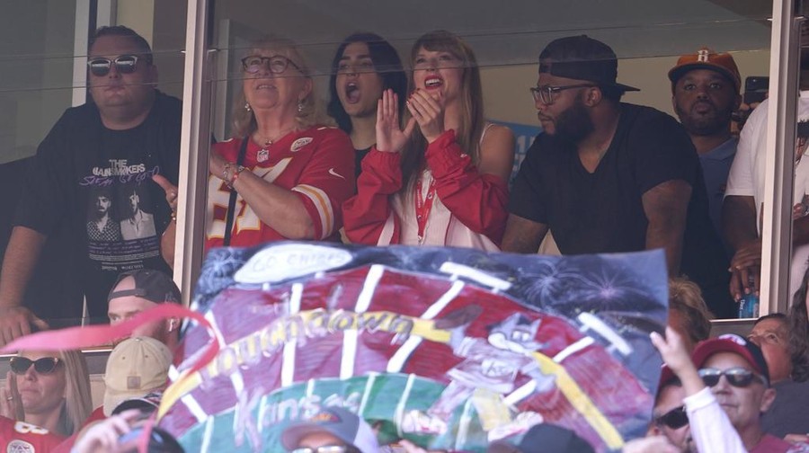 Taylor Swift watches from a suite inside Arrowhead Stadium during the first half of an NFL football game between the Chicago Bears and Kansas City Chiefs Sunday, Sept. 24, 2023, in Kansas City, Mo. (AP Photo/Ed Zurga)
