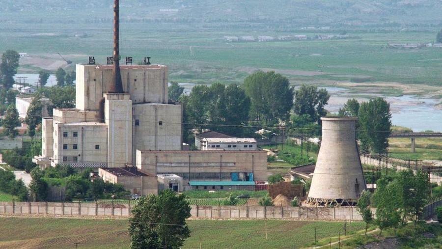 A North Korean nuclear plant is seen before demolishing a cooling tower (R) in Yongbyon, in this photo taken June 27, 2008 and released by Kyodo. North Korea is to restart the mothballed Yongbyon nuclear reactor that has been closed since 2007 in a move that could produce more plutonium for nuclear weapons as well as for domestic electricity production, its KCNA news agency said on April 2, 2013. As well as restarting the 5MW reactor at Yongbyon, the North's only known source of plutonium for its nuclear weapons programme, KCNA said a uranium enrichment plant would also be put back into operation, a move that could give it a second path to the bomb. Picture taken June 27, 2008. Mandatory Credit. REUTERS/Kyodo