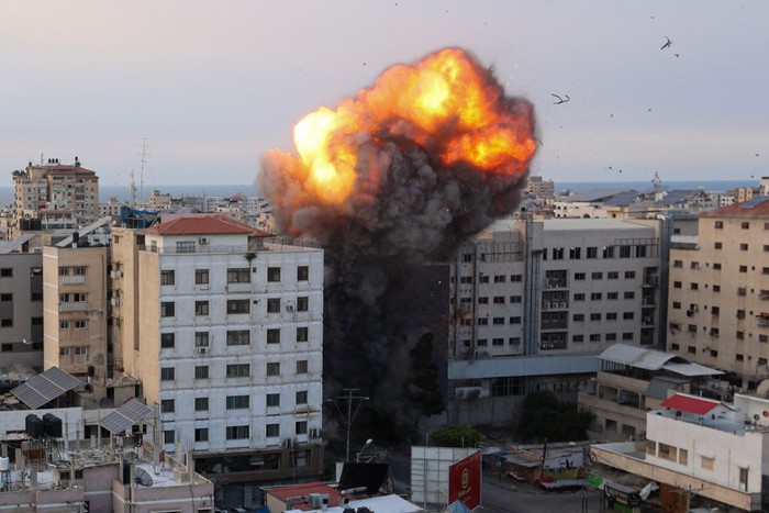 TOPSHOT - Fire and smoke rise after an Israeli air strike targeted the National Bank on Gaza City, on October 8, 2023. Israel, reeling from the deadliest attack on its territory in half a century, formally declared war on Hamas Sunday as the conflict's death toll neared 1,000 after the Palestinian militant group launched a massive surprise assault from Gaza. (Photo by Ahmed ZAKOUT / AFP) (Photo by AHMED ZAKOUT/AFP via Getty Images) TOPSHOT - Fire and smoke rise after an Israeli air strike targeted the National Bank on Gaza City, on October 8, 2023. Israel, reeling from the deadliest attack on its territory in half a century, formally declared war on Hamas Sunday as the conflict's death toll neared 1,000 after the Palestinian militant group launched a massive surprise assault from Gaza. (Photo by Ahmed ZAKOUT / AFP) (Photo by AHMED ZAKOUT/AFP via Getty Images)