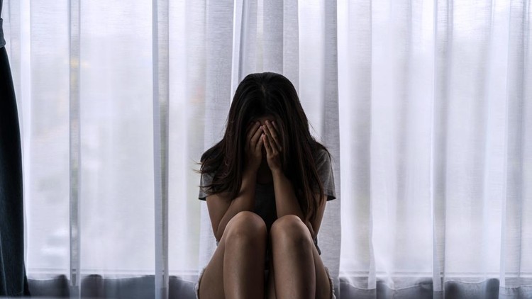 Lonely young woman feeling depressed and stressed sitting in the dark bedroom, Negative emotion and mental health concept