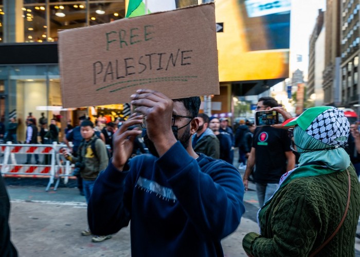 NEW YORK, NEW YORK - OCTOBER 13: Supporters of Palestine participate in a rally in Times Square to condemn the recent fighting in Gaza on October 13, 2023 in New York City. Across the country and around the world, people are holding rallies and vigils for both Palestinians and Israelis following a surprise attack by Hamas on October 7. The attack has resulted in a bombardment of Gaza by the Israeli military and a a possible ground invasion of the territory.   Spencer Platt/Getty Images/AFP (Photo by SPENCER PLATT / GETTY IMAGES NORTH AMERICA / Getty Images via AFP)