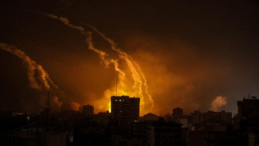 GAZA STRIP, GAZA - OCTOBER 28: Smoke rises and billows in different regions of Gaza as the Israeli army conducts the most intense air attacks on the 21st day in Gaza Strip, Gaza on October 28, 2023. Due to Israel cutting off electricity and not allowing fuel supplies, Gaza was plunged into darkness, and the sky was frequently illuminated by the bombs being dropped by Israeli aircraft. (Photo by Ali Jadallah/Anadolu via Getty Images)