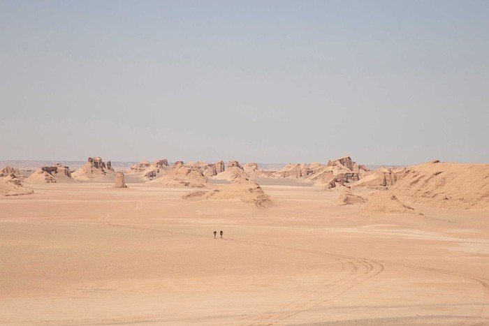 DASHT-E LUT, IRAN - OCTOBER 03: At The Ultramarathon Project, two athletes run together through the desert at Dasht-e Lut Desert on October 03, 2018 in Iran. (Photo by Daniele Frediani/Archivio Daniele Frediani/Mondadori Portfolio via Getty Images)