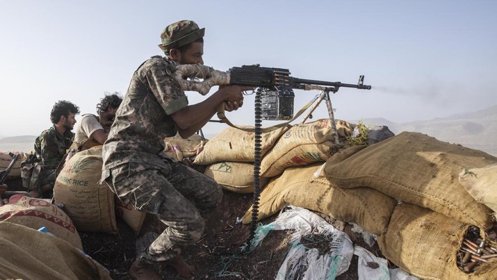 FILE - A Yemeni fighter backed by the Saudi-led coalition fires his weapon during clashes with Houthi rebels on the Kassara frontline near Marib, Yemen, June 20, 2021. Since the longest ceasefire between Yemen's warring parties ended without renewal late last year, Saudi Arabia and the Iranian-backed Houthis have once again been engaging in back-channel talks. While the negotiations have managed to achieve an immediate aim of maintaining an unofficial sort of temporary truce, they seem unlikely to help either side find a way out of the conflict. (AP Photo/Nariman El-Mofty, File)