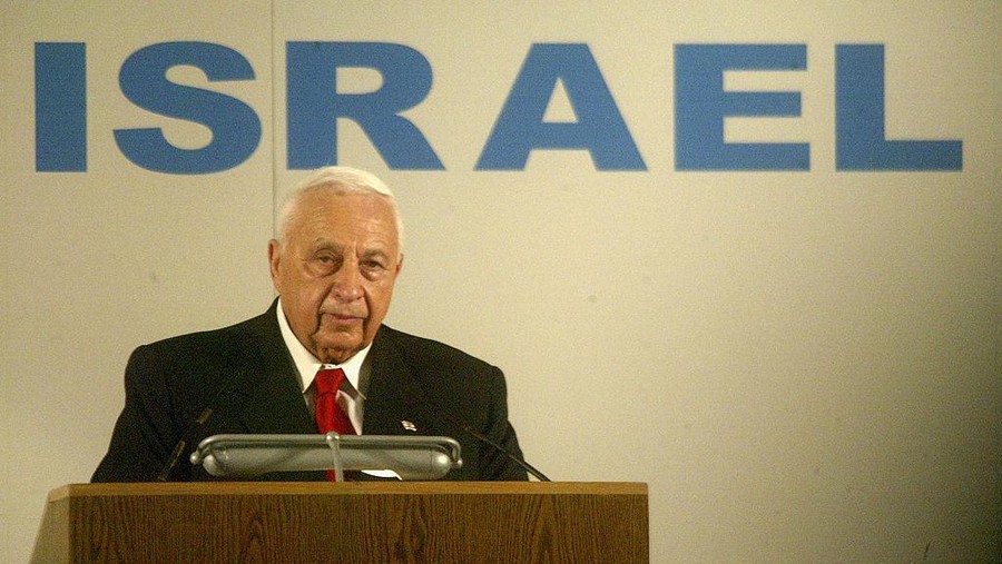 BEN GURION AIRPORT, ISRAEL - JULY 28: (ISRAEL OUT) Israeli Prime Minister Ariel Sharon welcomes French Jewish immigrants July 28, 2004 on their arrival at Israel's Ben Gurion Airport near Tel Aviv. The arrival of 200 new immigrants from France comes at the tail end of a row between Paris and Jerusalem over Sharon's call last week for French Jews to flee rising anti-Semitism. (Photo by Uriel Sinai/Getty Images)