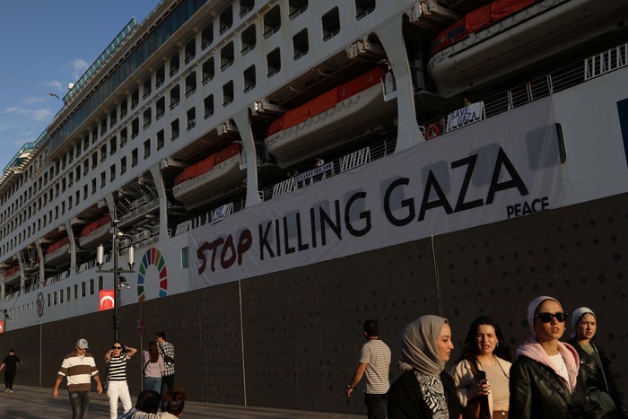 Peace activists onboard the Japan-based NGO Peace Boat's cruise ship Pacific World display placards in support of Gaza, amid the ongoing conflict between Israel and the Palestinian Islamist group Hamas, as the ship is docked at Galataport in Istanbul, Turkey November 5, 2023. REUTERS/Murad Sezer