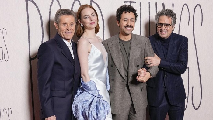 Emma Stone poses for photographers upon arrival at the premiere of the film 'Poor Things' on Thursday, Dec. 14, 2023 in London. (Scott A Garfitt/Invision/AP)