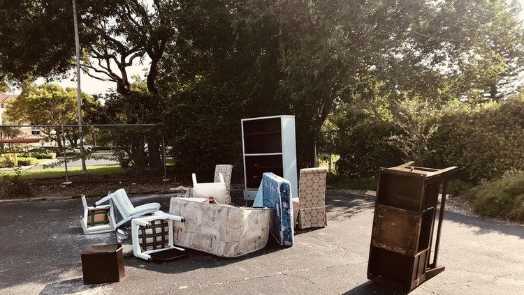 old broken furnitures thrown at side of street in Florida