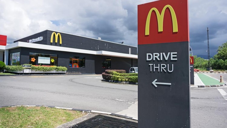 Kota Kinabalu, Malaysia - October 05, 2017: McDonald's logo against sky. McDonald's Corporation is the world's largest chain of hamburger fast food restaurants.