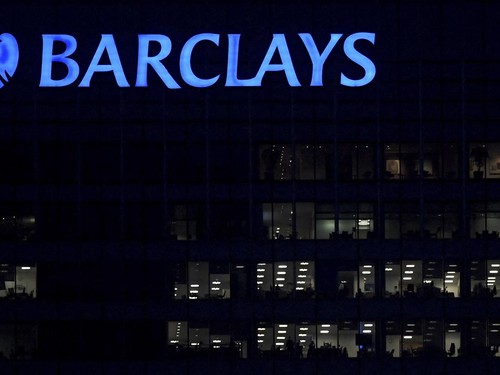 FILE PHOTO: Workers are seen in at Barclays bank offices in the Canary Wharf financial district in London, Britain, November 17, 2017. Picture taken November 17, 2017. REUTERS/Toby Melville/File Photo